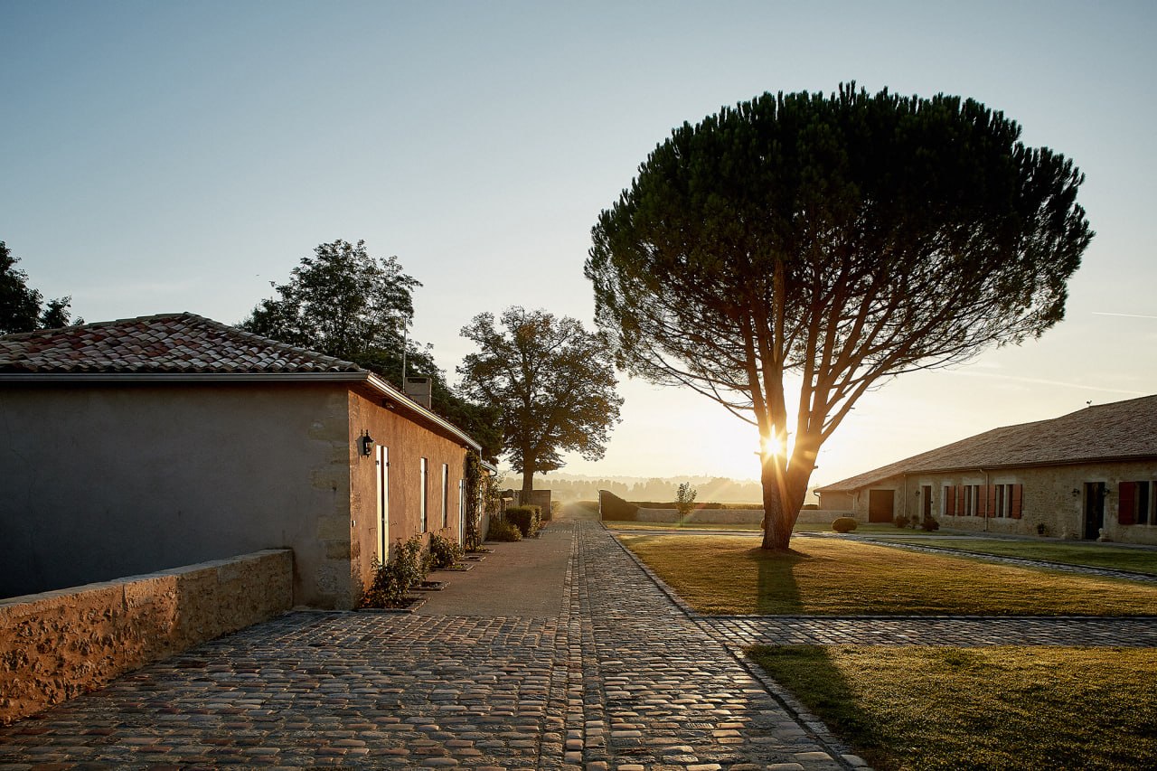 Estate courtyard at golden hour — the atmosphere of Glass of Emotions