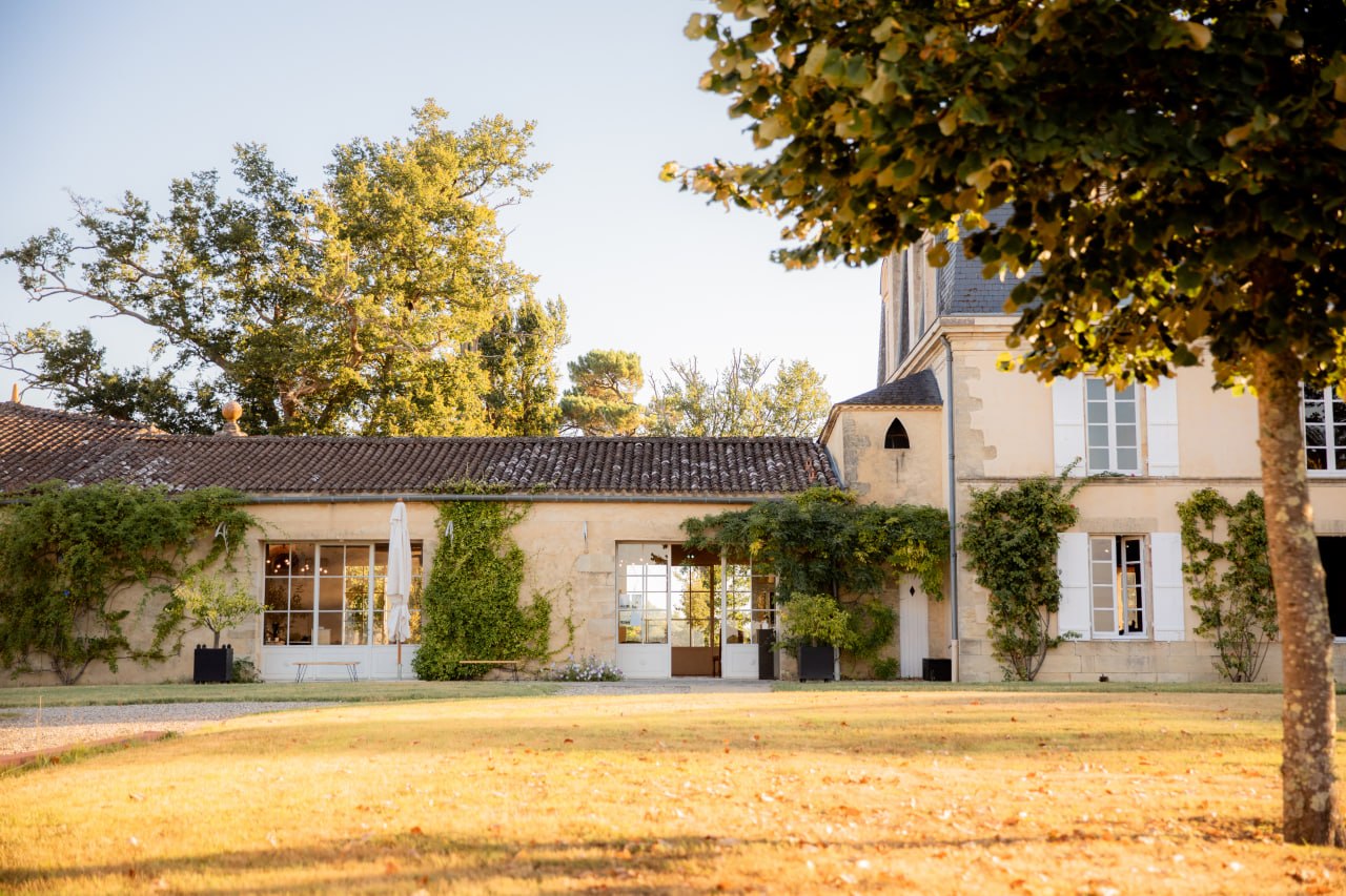 Historic Medoc wine estate courtyard in warm golden light