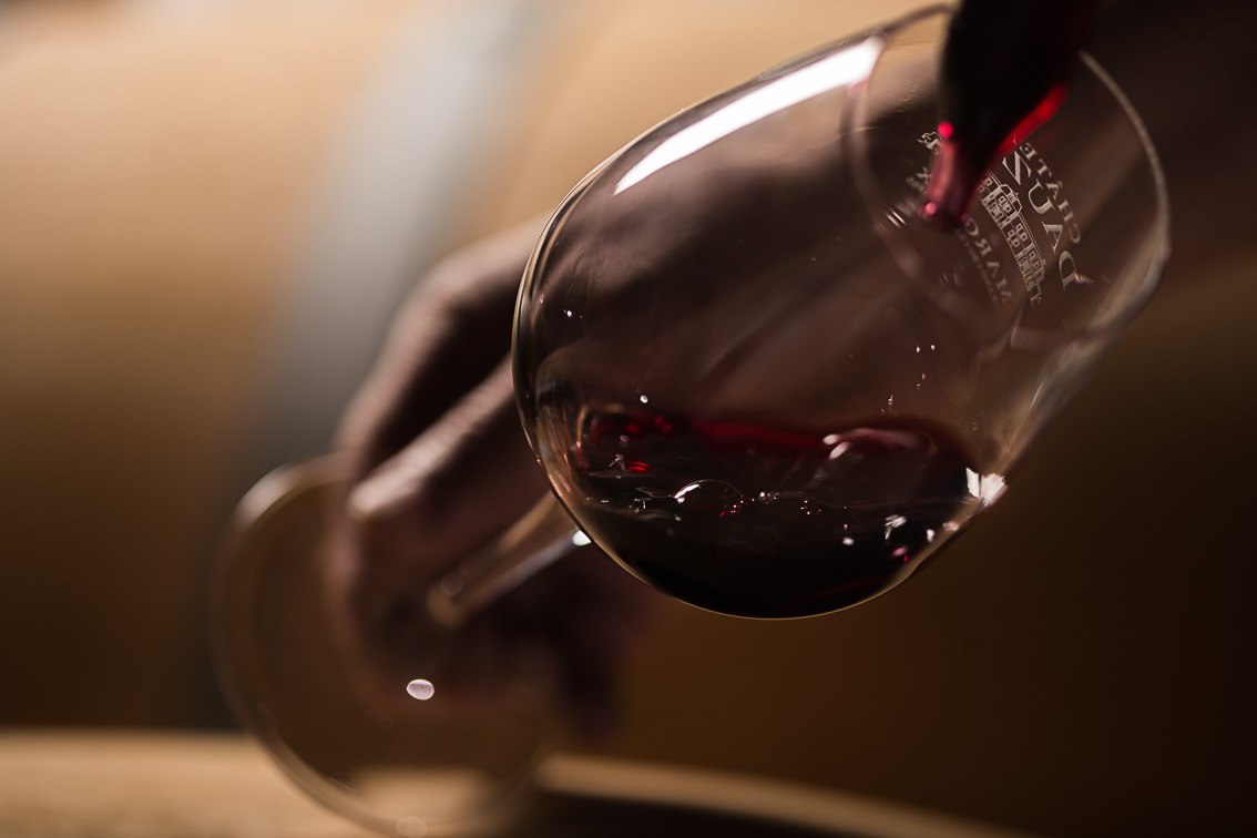 An intimate wine tasting with red wine in a crystal glass